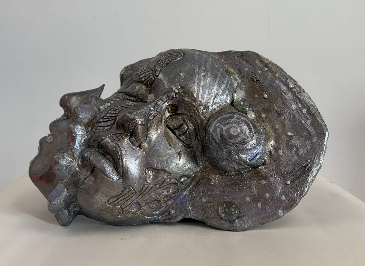 Head with Shells and Pearls, front